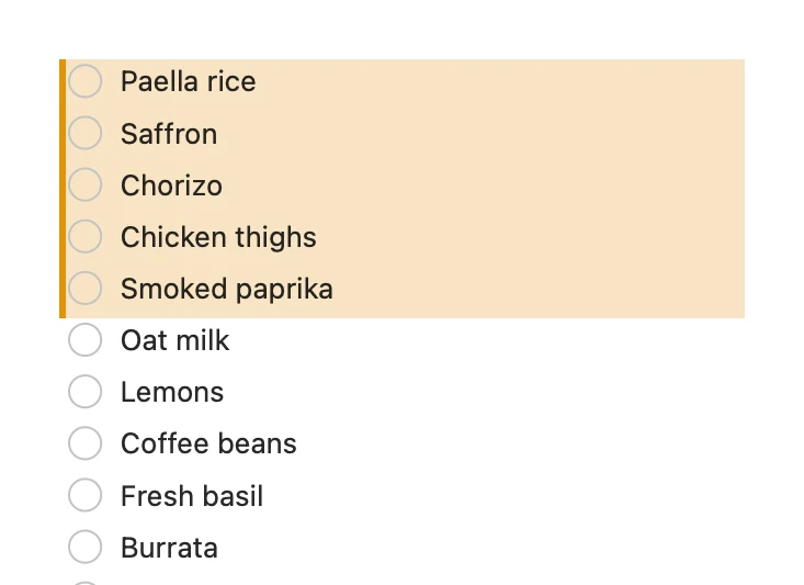 A grocery checklist with the five lines an AI added tinted